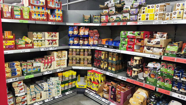 Iserlohn, Germany - May 22, 2026: Supermarket aisle displaying a wide selection of tea, coffee, and hot chocolate products on shelves inside PENNY supermarket