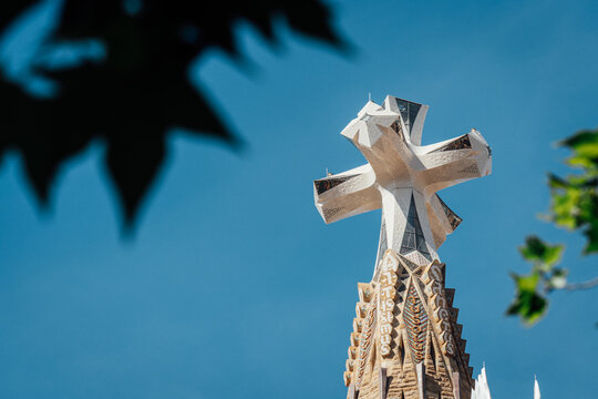 Barcelona, Spain. June 13, 2026, Sagrada Familia's Tower of Jesus Christ with a four armed cross, an iconic symbol of Antoni Gaudi's UNESCO basilica in Barcelona