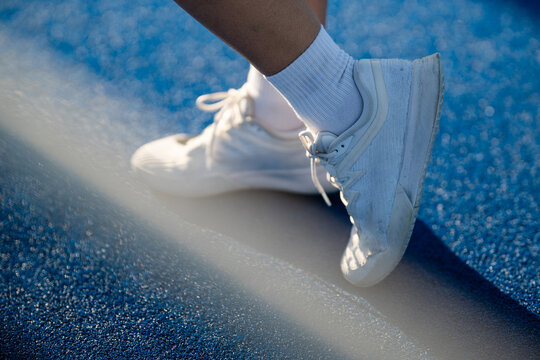 Athlete's foot wearing nike sneakers on padel court