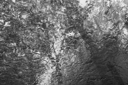 Abstract Rain Pattern on Glass Window in Black and White