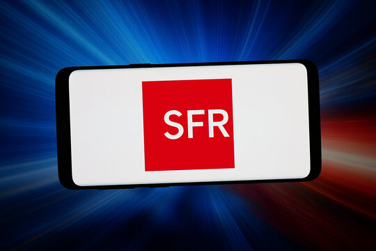 Stuttgart, Germany - 06-11-2026: In this photo illustration, the logo of French telecommunications company SFR S.A. is displayed on a smartphone in front of abstract background on computer screen.