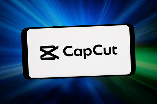Stuttgart, Germany - 06-11-2026: In this photo illustration, the logo of video editing app CapCut (JianYing) is displayed on a smartphone in front of abstract background on computer screen.