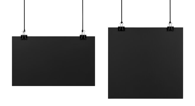 Blank black posters on binder clips