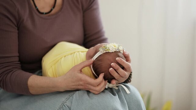 Photographer Wraps Newborn For Photo Shoot
