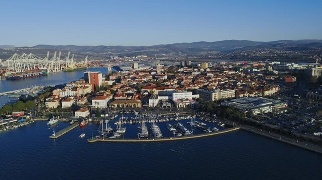 Koper, Slovenia offers a view of the Adriatic Sea with its marina and buildings as the sun sets over this coastal city.