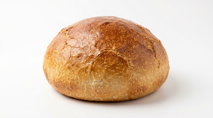 Fototapeta premium A crusty, golden-brown loaf of bread sits on a white surface, showcasing its cracked texture and rustic appearance, perfect for baking or food-related concepts.