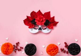 Fototapeta premium Dia de los Muertos, Mexican holiday Day of the Dead and Halloween. Carnival Catarina mask, candles, flowers on pink background. Concept poster, banner, festive card.