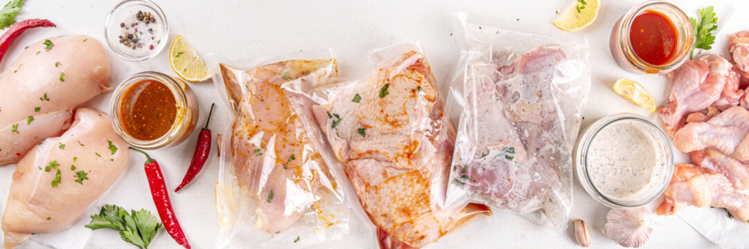 Viral trendy way of cooking meat. Several bags of marinated chicken meat in storage freezing bags with various taste marinades. Quick and healthy simple recipe of cooking dinner