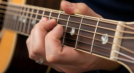 Fototapeta premium Acoustic guitar close-up: musician plays chords