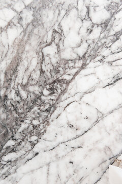 Marble texture background with lines and patterns that show natural design and color variations commonly seen in stone surfaces