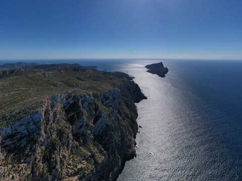 Aerial view of the rugged cliffs at Mirador Josep Sastre overlooking the Mediterranean Sea and Sa Dragonera island in Andratx, Balearic Islands, Spain.