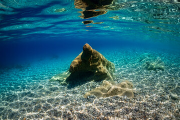 a boulder with a very particular shape under the sea © Pinosub