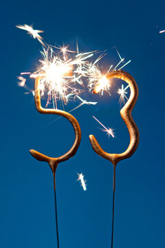 53 years celebration festive background made with Bengal fires in the form of number Fifty three. Vertical photography.