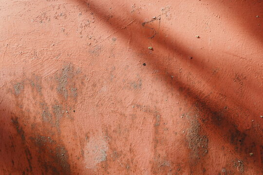 Muted Terracotta Abstract Textured Surface Background with Soft Diagonal Shadows for Organic Copy Space Matte and Dusty Earthy Gritty Feel