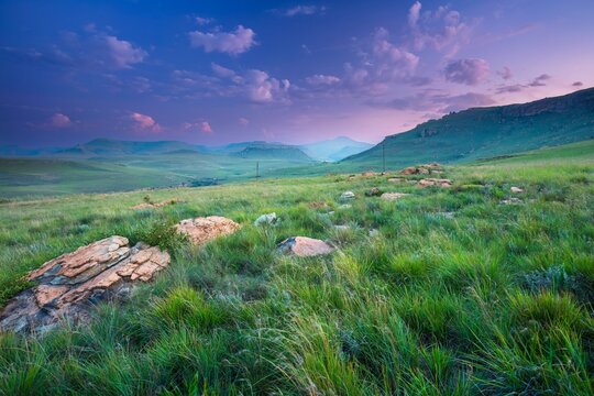 Beautiful evening twilight over the vast green grasslands and blue waters of Sterkfontein Dam Nature Reserve, South Africa.