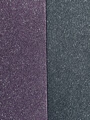 Fototapeta premium Two textured surfaces, purple and dark gray background