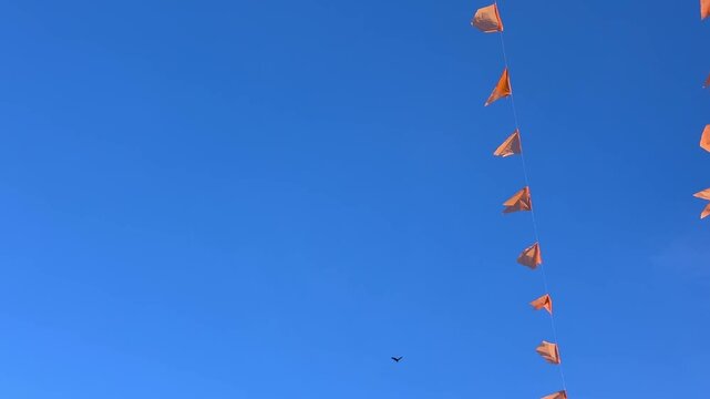 Festival flags in blue sky