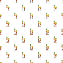 Fototapeta premium Green houseplants in pots on wooden stands forming a repeating background pattern