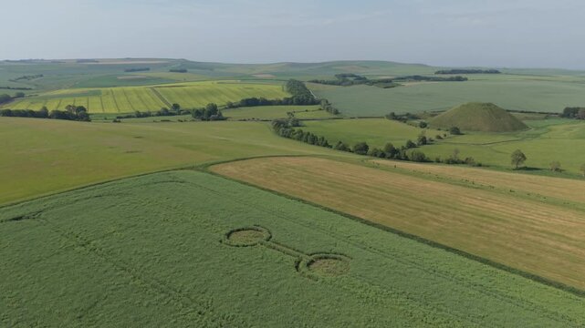 Aerial footage of a mysterious, intricate, geometric crop art, crop circle formation in a barley field near Waden Hill, Silbury Hill, West Kennet Avenue, Avebury, Wiltshire, England, UK; 29 April 2026