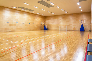Interior of empty modern basketball or soccer indoor sport court © Maria