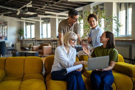 Business people collaborating on project in creative office space