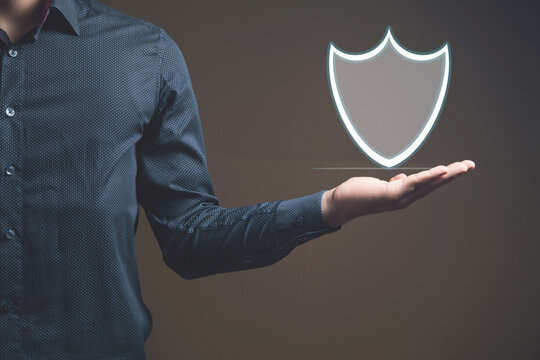 a man taps on a screen with a virtual shield