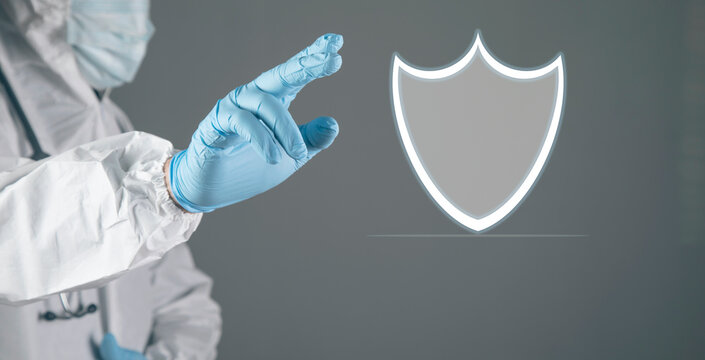 a man taps on a screen with a virtual shield