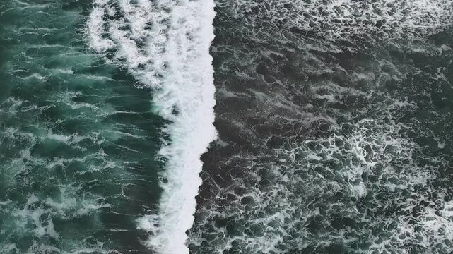 Waves crashing flowing drone FPV aerial view