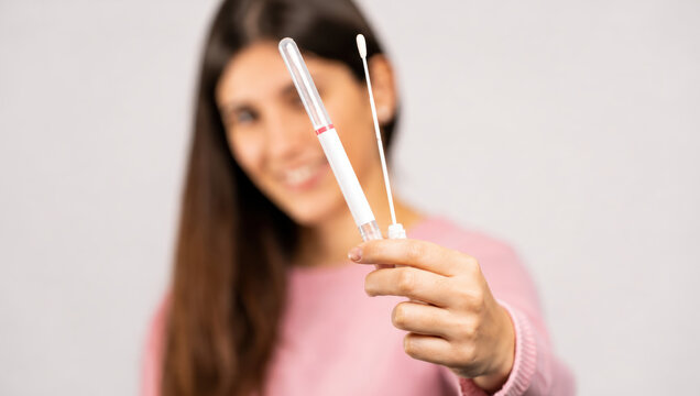 Woman Holding HPV Self-Test Kit with Collection Swab and Sample Tube for Cervical Screening