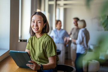 Woman working with tablet in modern co working office