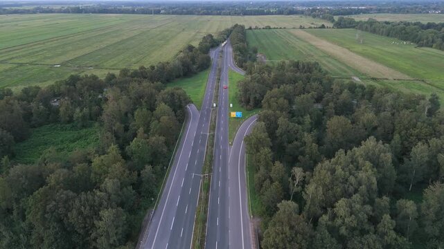 Autobahn highway curving through fields forest aerial Bremen Germany