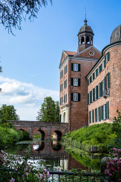 Eutin castle with moat and historic bridge on a sunny summer day, Schleswig-Holstein, Germany