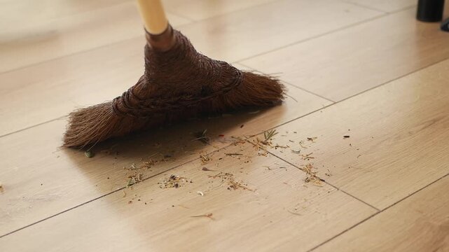 Cleaning dust and dirt from the wooden floor