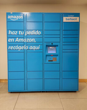 30-04-2026, Albacete, Spain, Blue Amazon Hub Locker automated parcel delivery system with Spanish text indoors