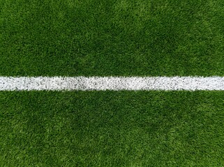 Fototapeta premium Close-up of clean white line markings on a green soccer field