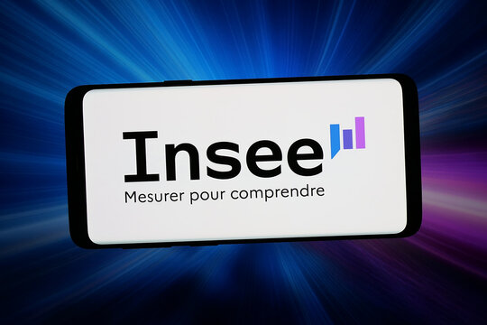 Stuttgart, Germany - 06-11-2026: In this photo illustration, the logo of French national statistics institute INSEE is displayed on a smartphone in front of abstract background on computer screen.