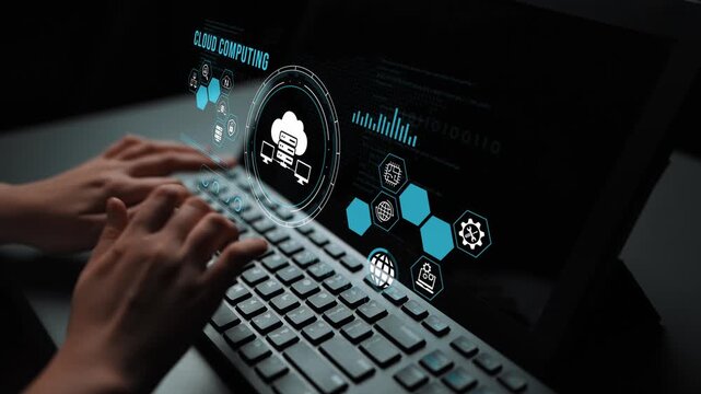 Hands using laptop with holographic cloud computing interface, data visualization, and modern technology representation for digital transformation concepts. Entropy.