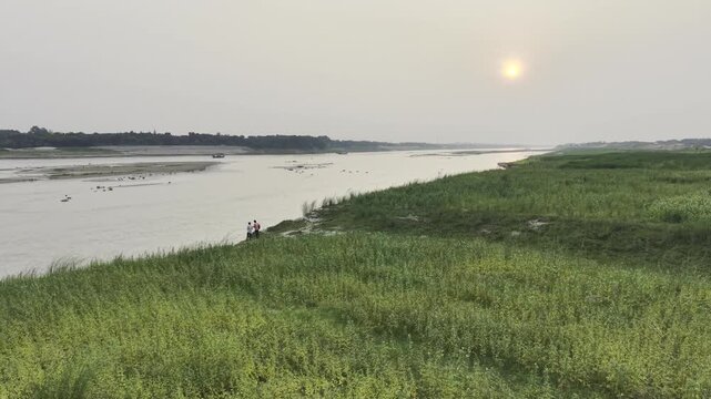 Scenic sunset landscape captured from a drone above the Garai River, a distributary of the Padma River.
