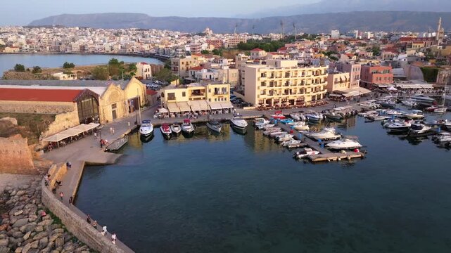 Beautiful Old city, Greece and best scenic places - panorama of picturesque old town Chania. Crete island, Panoramic of the old Venetian port and lighthouse during the blue hour, Travel Concepts