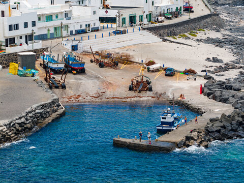 Aerial Panorama of La Santa Traditional White Fishing Village and Volcanic Rocky Coastline in Lanzarote