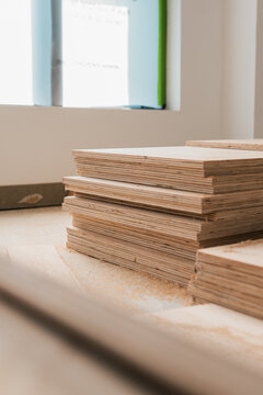 Stack of wooden boards on a construction site, building materials plywood board