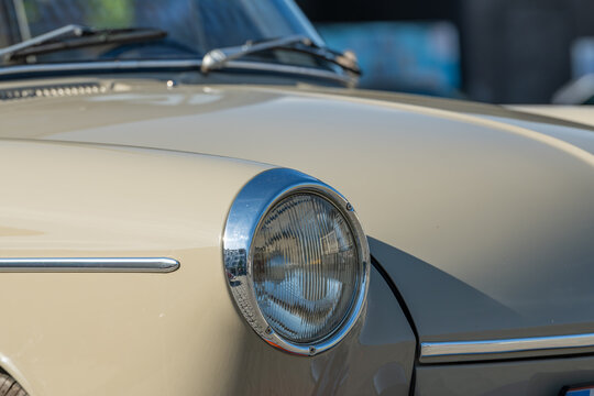 26 April 2026, Diepenbeek, Belgium. Close-up of Volkswagen 1500 vintage car headlight and front body detail during outdoor event