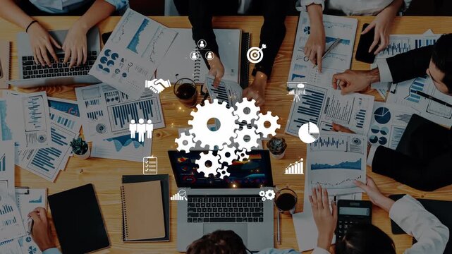 A dynamic corporate meeting featuring team members collaborating on business data analysis with charts and reports, utilizing digital tools for effective decision making. Raster