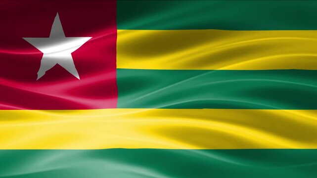 Flag of Togo waving in the wind. National symbol of Togolese Republic with fabric texture details.