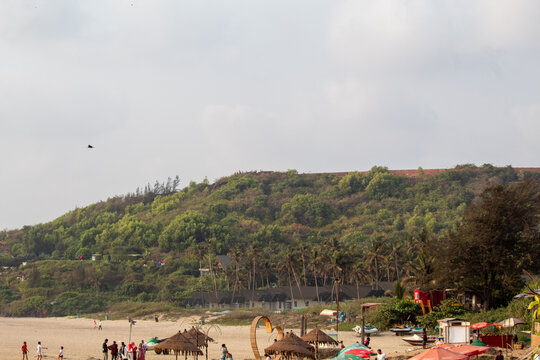 Crowded Vagator Beach in Goa India with Tourists Enjoying the Arabian Sea