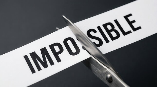 Scissors cutting the word impossible to reveal possibility.