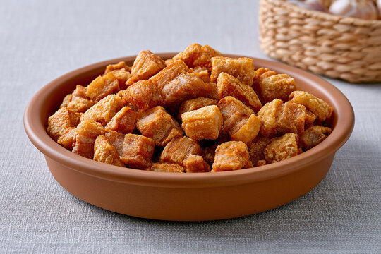 Fried pork crackling named Brazilian Torresmo on the table