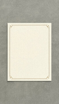 Blank Ivory Certificate Frame on Textured Gray Background Minimalist Flat Lay