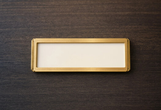 Empty Gold Nameplate on Dark Textured Background Minimalist Flat Lay