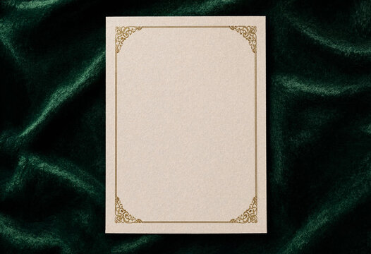 Blank ornate certificate frame on rich emerald green velvet background texture